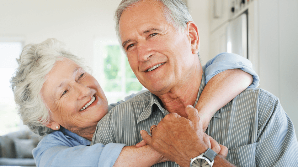 Old loving heterosexual couple arm in arm to explain the benefits of rapamycin supplements